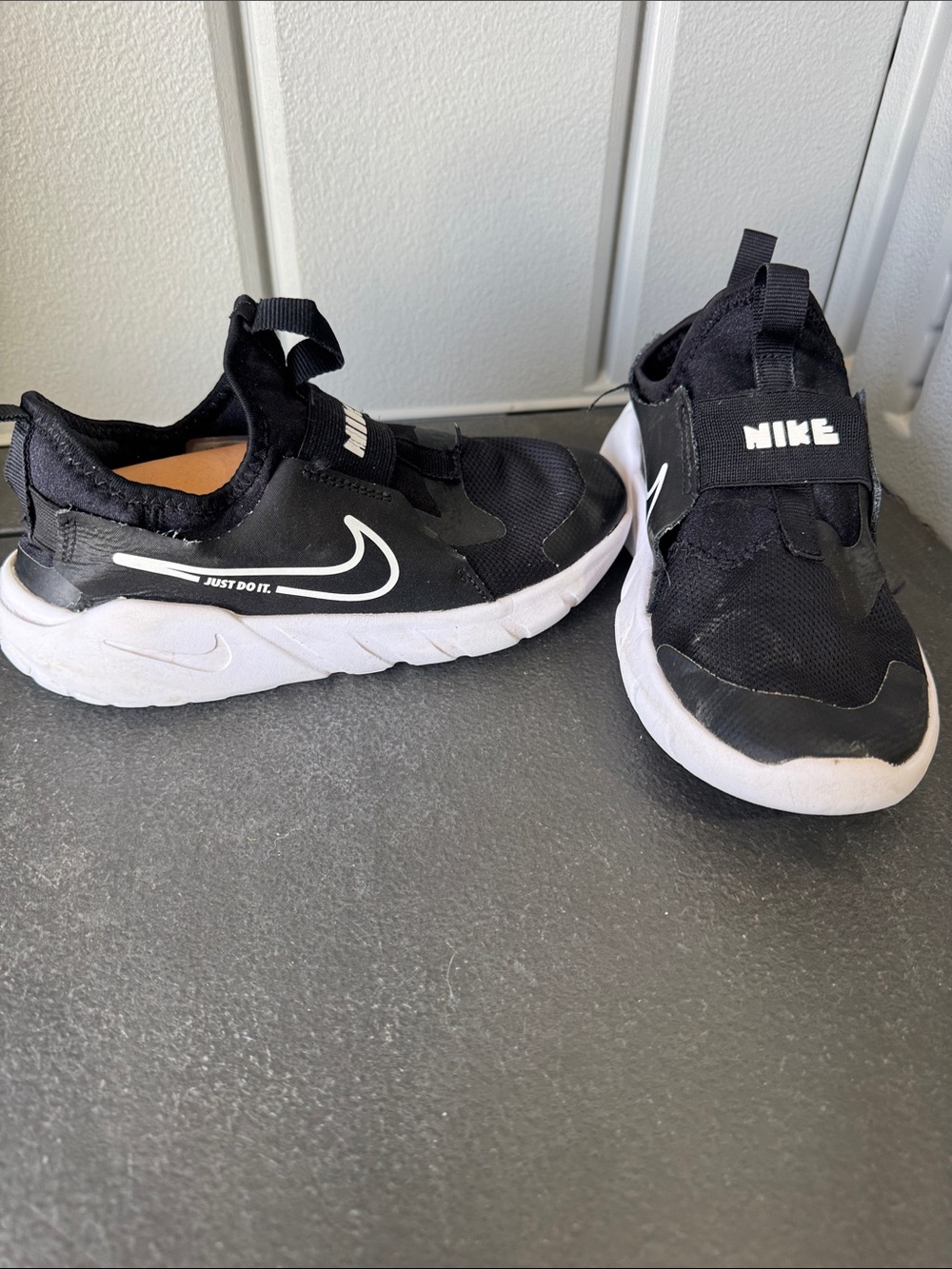 Nike Kids Black and White Slip-On Sneakers with Hook Strap